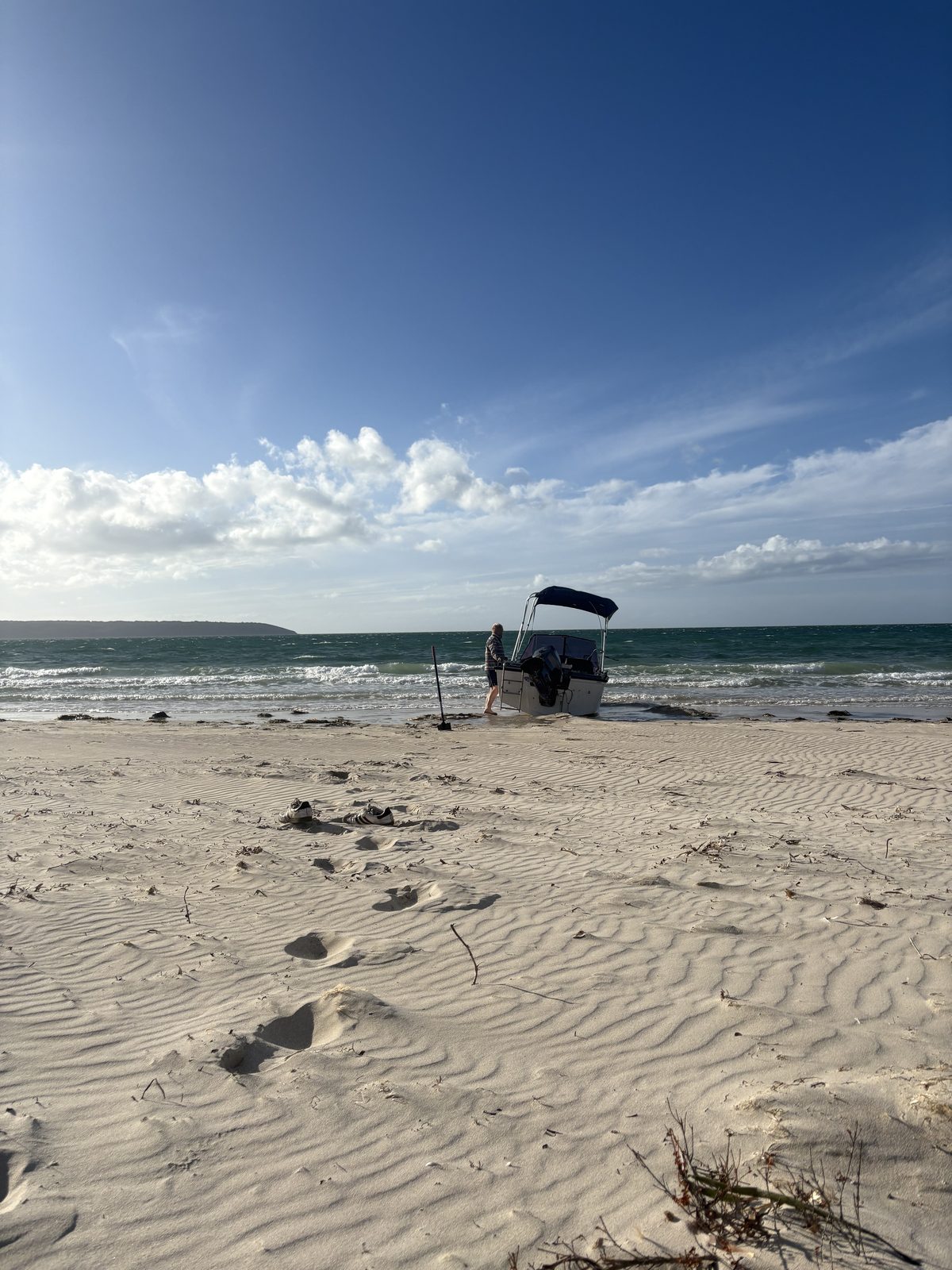 A small boat beached on the sand